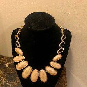 Gold tone statement necklace with small rhinestone accents
